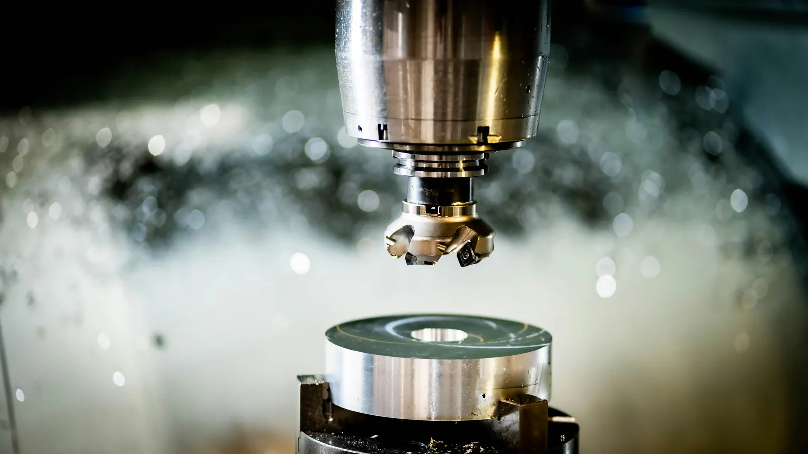 3-axis CNC milling machine producing a precision metal part